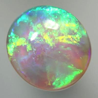 SOLID CRYSTAL OPAL Rolling flashes of orange and green fire 